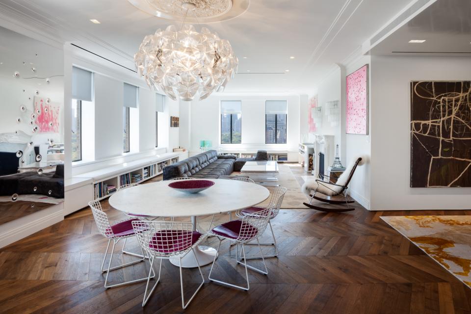 The apartment’s herringbone floors were inspired by the apartment in Paris that the family rents annually. Pamela’s favorite piece of art, a stainless steel sheet riddled with bullet holes, by Margaret Evangeline, hangs on the left.