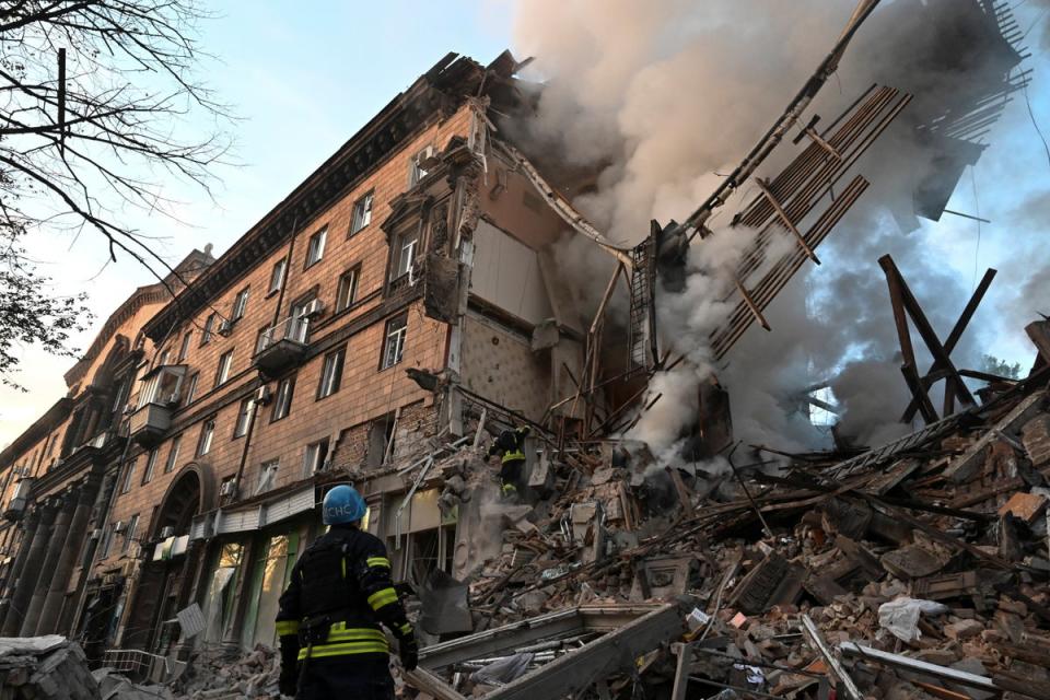 Rescuers work at a residential building which was heavily damaged by a Russian missile strike (REUTERS)