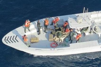 The Pentagon released this picture it says shows members of the Islamic Revolutionary Guard Corps Navy after removing an unexploded limpet mine from the M/T Kokuka Courageous (REUTERS)