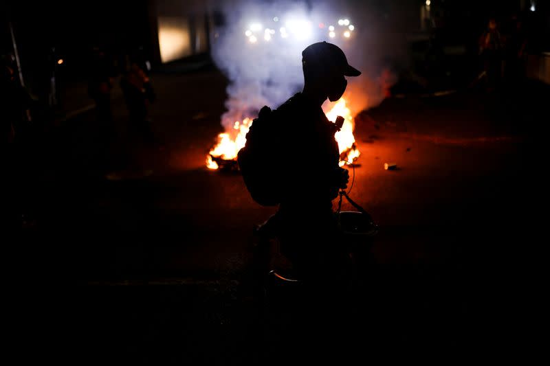 Protesters gather outside the Portland Police Bureau's North Precinct on the 101th consecutive night of protests against police violence and racial inequality, in Portland