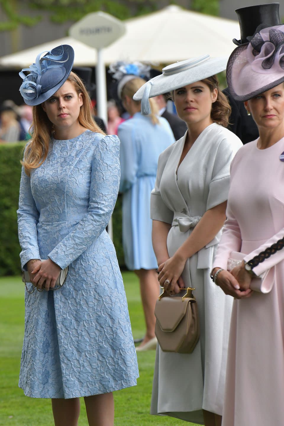 <p>Princess Eugenie opted for a kimono-style wrap dress and matching wide-brimmed hat.</p>