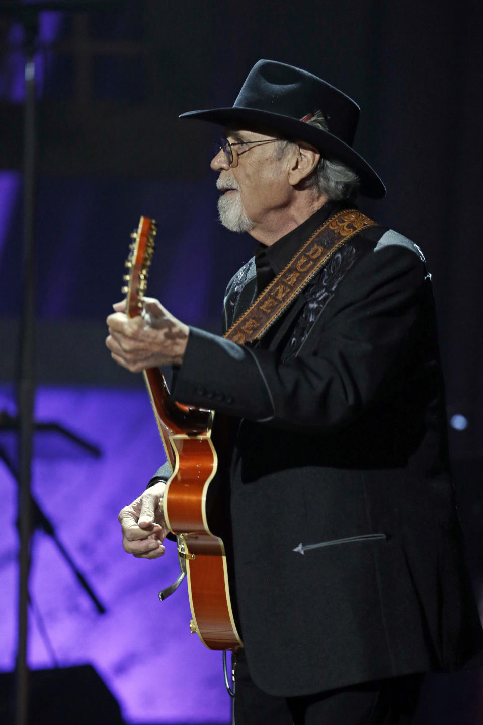 FILE - Duane Eddy performs during the Americana Music Honors and Awards show, Sept. 18, 2013, in Nashville, Tenn. Eddy, a pioneering guitar hero whose reverberating electric sound on instrumentals such as "Rebel Rouser" and “Peter Gunn” helped put the twang in early rock 'n' roll and influenced George Harrison, Bruce Springsteen and countless other musicians, died of cancer Tuesday, April 30, 2024. He was 86. (AP Photo/Mark Humphrey, File)