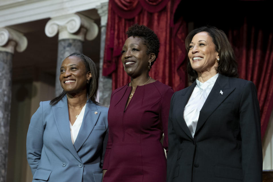 From left, Sen. Laphonza Butler, D-Calif., her wife Neneki Lee and Vice President Kamala Harris stand for photographers during a re-enactment of the swearing-in ceremony on Tuesday, Oct. 3, 2023, on Capitol Hill in Washington. (AP Photo/Stephanie Scarbrough)