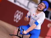 <p>Italy's Simone Consonni celebrates after winning gold and setting a new World Record in the men's track cycling team pursuit finals during the Tokyo 2020 Olympic Games at Izu Velodrome in Izu, Japan, on August 4, 2021. (Photo by Odd ANDERSEN / AFP) (Photo by ODD ANDERSEN/AFP via Getty Images)</p> 