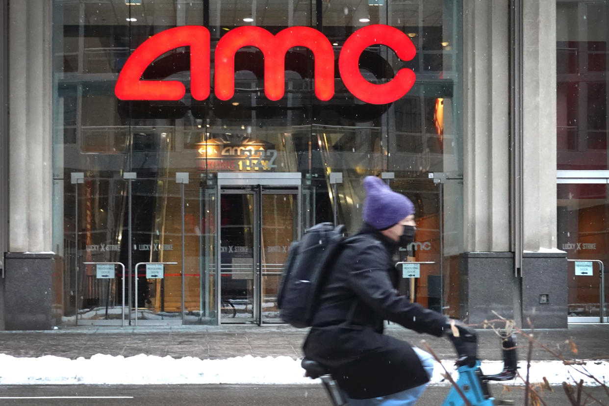 CHICAGO, ILLINOIS - JANUARY 27: A sign hangs in front of an AMC theater on January 27, 2021 in Chicago, Illinois. Shares of AMC Entertainment more than quadrupled today as investors continue their buying spree on heavily shorted stocks. (Photo by Scott Olson/Getty Images)