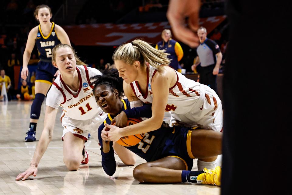 Toledo guard Khera Goss (22) battles for the ball with Iowa State's Ashley Joens, right, and Emily Ryan (11) in the first half of Saturday's NCAA Tournament game in Knoxville, Tenn.