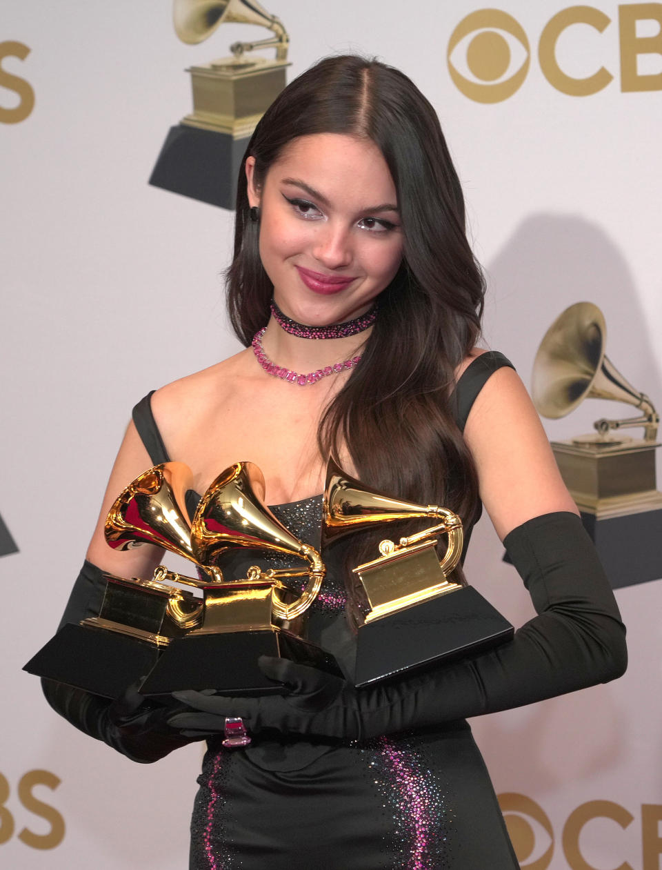 Olivia holding Grammys