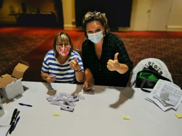 Court stenographers counting votes in Moncton, where 96 per cent favoured a strike.   (CUPE NB  - image credit)