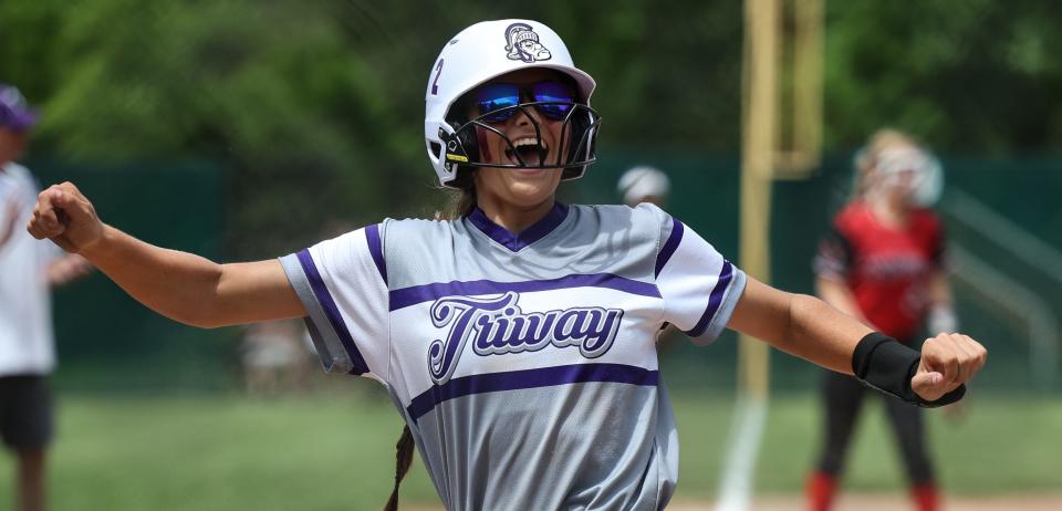 Triway's Hanna Massaro is super pumped after scoring the game's second run in the second inning.
