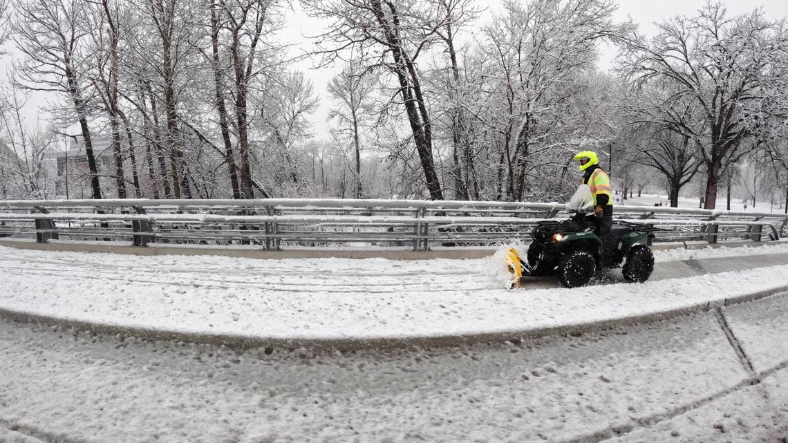 A small plow removes snow from the sidewalk on Broadway Ave. near Boise State University, Thursday, March 30, 2023. Over two inches of snow fell in the Boise-area valley, with larger amounts of snow accumulating at higher elevations.