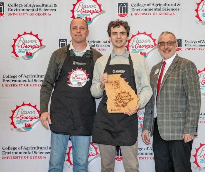 New Creation Soda Works CEO Paul Kooistra, from left, head brewer Alex Harding, and UGA Agriculture Dean Nick Place at the Flavor of Georgia awards presentation.