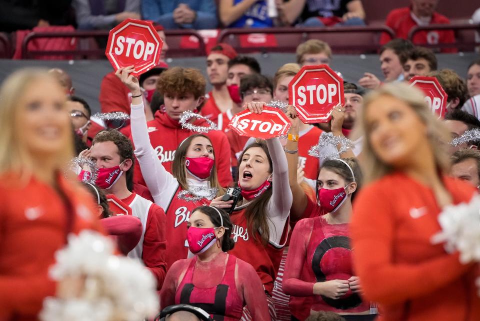 Ohio State Buckeyes fans cheer prior to the NCAA men's basketball game against the Duke Blue Devils at Value City Arena in Columbus on Wednesday, Dec. 1, 2021. 