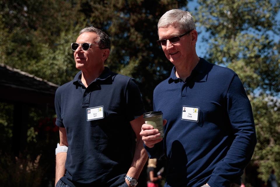 Disney CEO Bob Iger walks with Apple CEO Tim Cook during the annual Allen & Company Sun Valley Conference, July 6, 2016 (Photo by Drew Angerer/Getty Images)