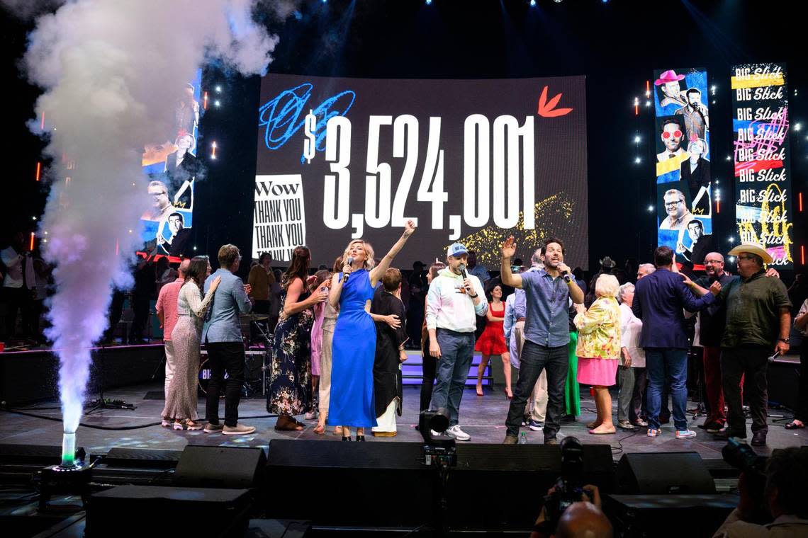 Big Slick hosts Heidi Gardner, from left, Jason Sudeikis, Paul Rudd, Rob Riggle (turned away) and Eric Stonestreet (at right) celebrate a record total raised for Children’s Mercy.