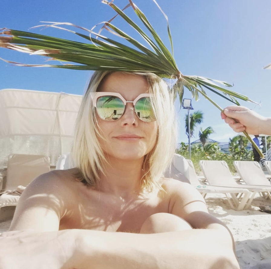 <p>“Had a pretty busy day making my kids hold up some extra sun cover so I could stay on this beautiful beach A.L.A.P. (As Long As Possible),” the<em> Good Place</em> star wrote, while on a family vacation in Turks and Caicos. “Yes, my 4 yr old is actually holding that palm leaf.” (Photo: <a rel="nofollow noopener" href="https://www.instagram.com/p/BeuF6clBb_r/?taken-by=kristenanniebell" target="_blank" data-ylk="slk:Kristen Bell via Instagram;elm:context_link;itc:0;sec:content-canvas" class="link ">Kristen Bell via Instagram</a>) </p>