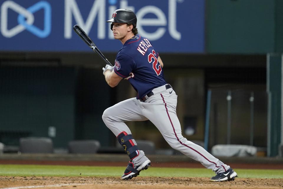 Minnesota Twins' Max Kepler watches a single during the eighth inning of the team's baseball game against the Texas Rangers, Saturday, July 9, 2022, in Arlington, Texas. (AP Photo/Tony Gutierrez)