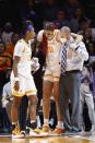 Tennessee center Tamari Key (20) is helped pff the court after being injured during an NCAA college basketball game against Kentucky, Sunday, Jan. 16, 2022, in Knoxville, Tenn. (AP Photo/Wade Payne)