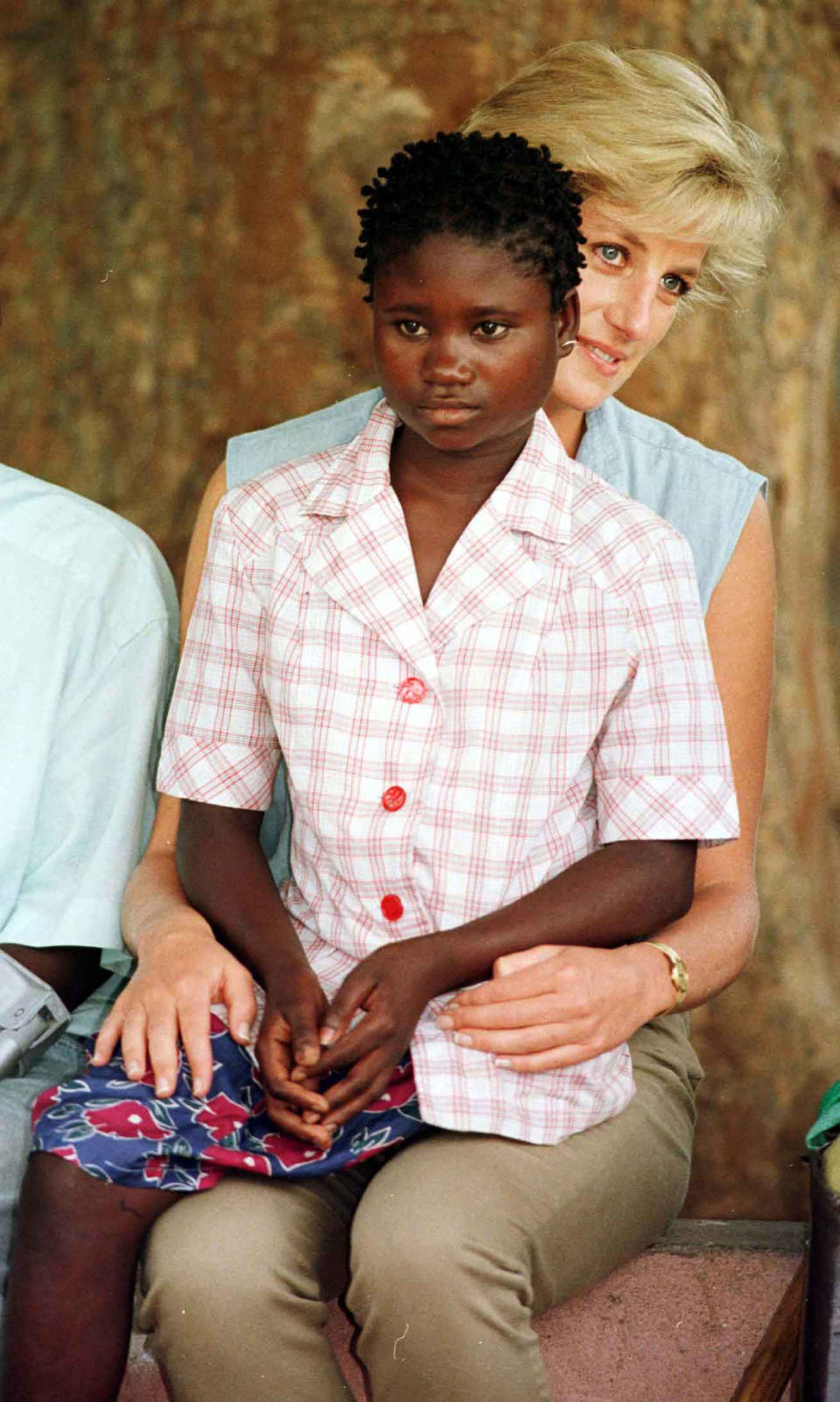 File photo dated 14/01/97 of Diana, Princess of Wales, with Sandra Tigica 13, at the orthopaedic workshop in Neves Mendinha, near Launda, Angola. The Duke of Sussex met Sandra Tigica again today, on day five of the royal tour of Africa.