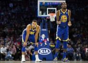 Nov 18, 2017; Philadelphia, PA, USA; Golden State Warriors guard Stephen Curry (30) and forward Kevin Durant (35) watch on during foul shots against the Philadelphia 76ers during the fourth quarter at Wells Fargo Center. Mandatory Credit: Bill Streicher-USA TODAY Sports