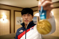 South Korea's Skeleton Gold medalist Yun Sung-bin poses for photographs with his Gold medal during an interview with Reuters in Pyeongchang, South Korea, February 18, 2018. REUTERS/Kim Hong-Ji