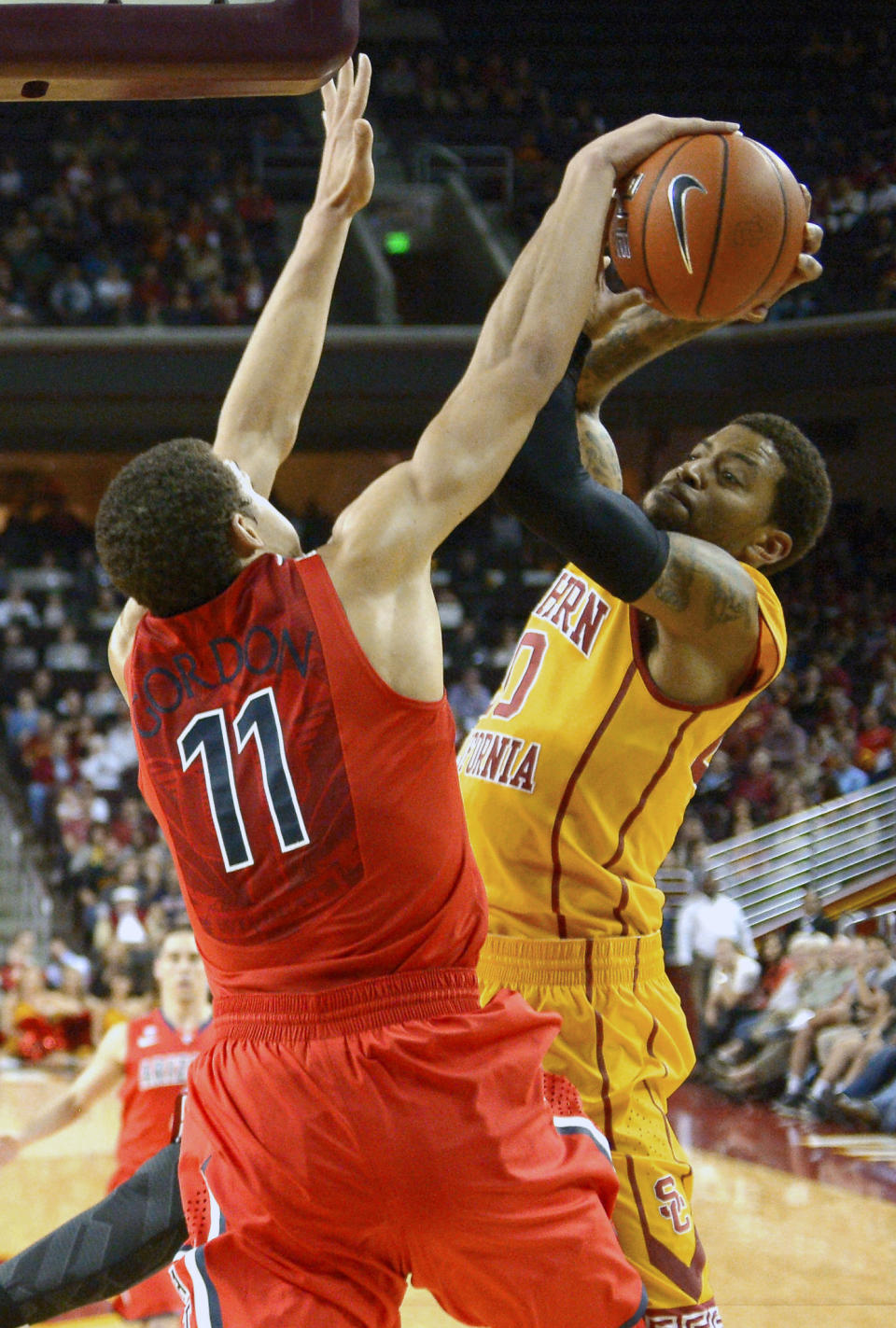 Southern California guard J.T. Terrell, right, has his shot blocked by Arizona forward Aaron Gordon during the first half of an NCAA college basketball game, Sunday, Jan. 12, 2014, in Los Angeles. (AP Photo/Mark J. Terrill)