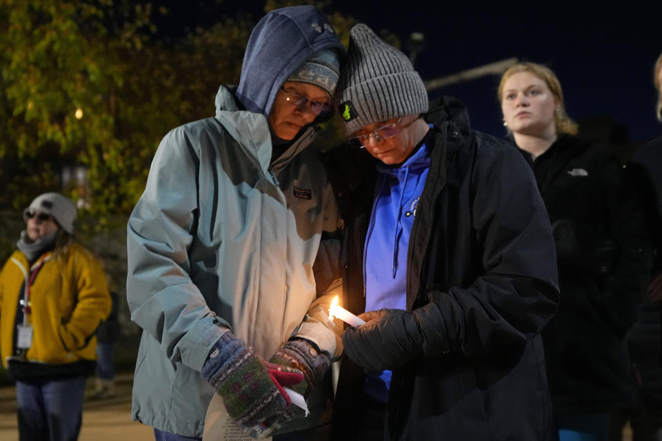 Community members gather Thursday, Nov. 2, 2023, during a candlelight vigil in Auburn, Maine. Locals seek a return to normalcy after a mass shooting in Lewiston on Oct. 25. (AP Photo/Matt York)