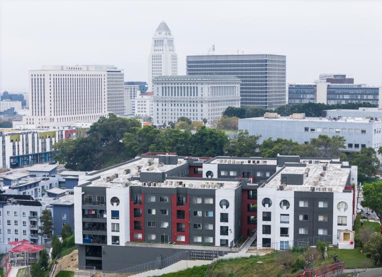 LOS ANGELES, CA- APRIL 12: The Los Angeles City Council appears to be working on a deal to rescue the tenants living at Hillside Villa (foreground) in Chinatown in Los Angeles, CA where dozens of renters had been facing steep rent increases. Photographed on Friday, April 12, 2024. (Myung J. Chun / Los Angeles Times)