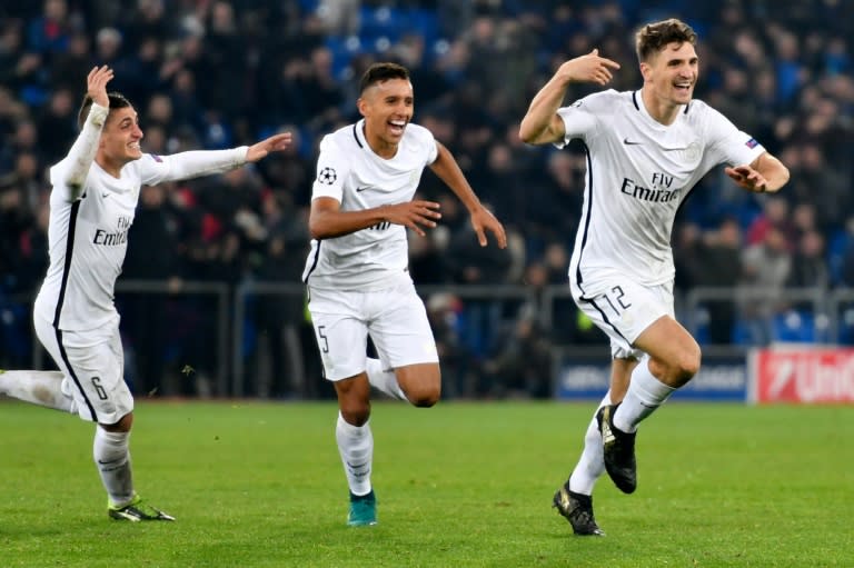 Paris Saint-Germain's Belgian defender Thomas Meunier (R) celebrates with teammates after scoring a goal against FC Basel on November 1, 2016 at the St Jakob-Park in Basel