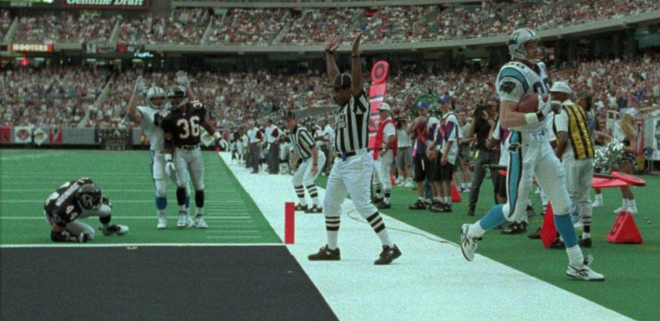 Carolina Panthers tight end Pete Metzelaars scores the first TD in team history on Sept. 3, 1995, against the Atlanta Falcons. Metzelaars scored on a touchdown pass from quarterback Frank Reich, who would become the Panthers’ head coach 28 years later.