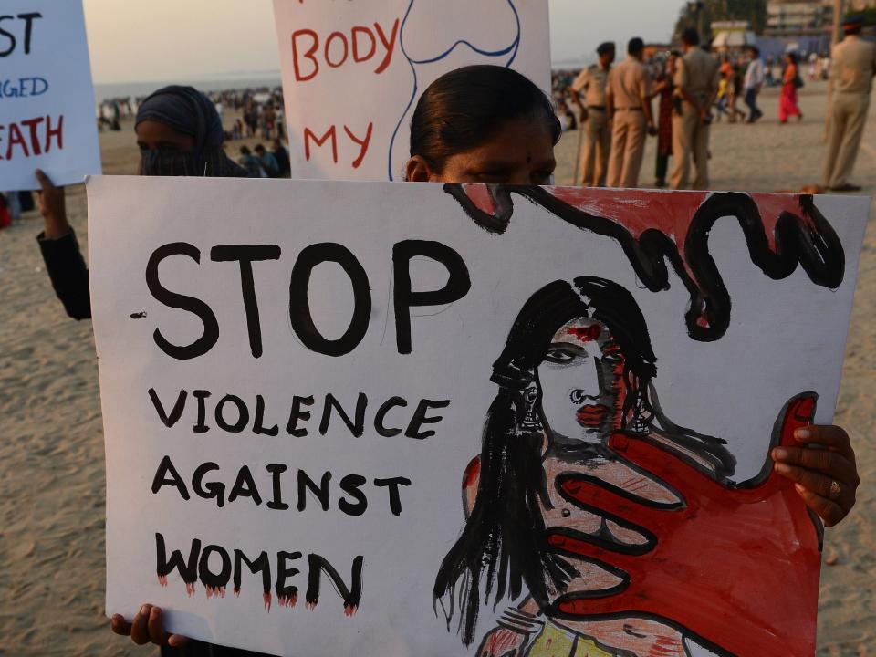 Members of NGO 'Aastha' hold placards during an anti-rape protest in Mumbai: Getty
