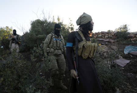 Turkish-backed Free Syrian Army fighters are seen near the city of Afrin, Syria February 19, 2018. REUTERS/Khalil Ashawi