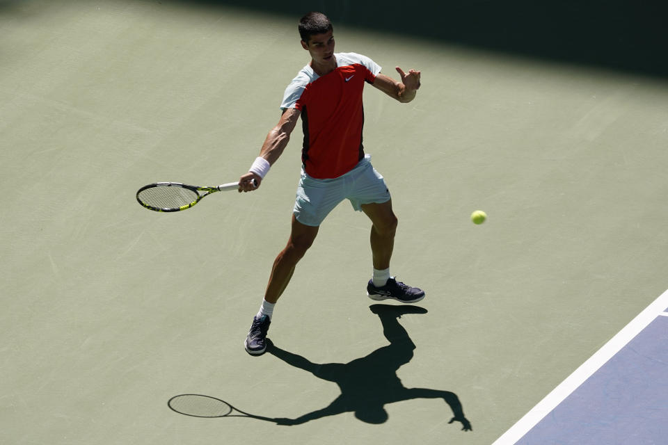 Carlos Alcarez, of Spain, returns a shot to Sebastian Baez, of Argentina, during the first round of the US Open tennis championships, Tuesday, Aug. 30, 2022, in New York. (AP Photo/Seth Wenig)