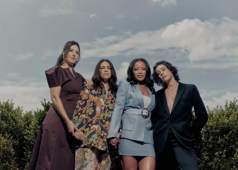 NEW YORK, NY -- AUGUST 11, 2022: The cast of the 2022 series "A League of Their Own" (from left to right) D'Arcy Carden, Abbi Jacobson, Chante Adams, and Roberta Colindrez pose for a portrait outdoors at the Bowery Hotel in Manhattan, NY on August 11, 2022. Photographed for a story on the new Amazon Prime series "A League of Their Own," adapted from the 1992 classic sports film of the same name. (Evelyn Freja / For The Times)