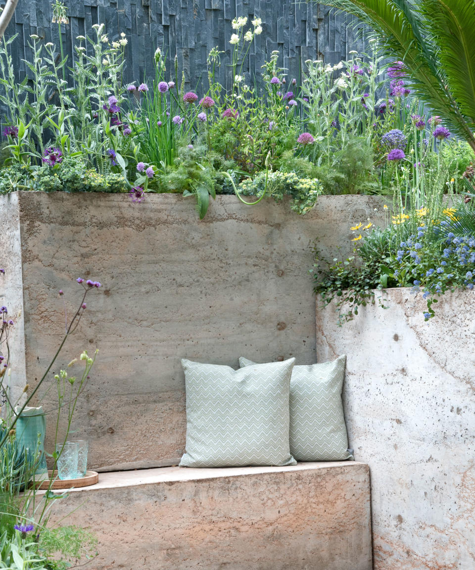 raised flowerbeds and integrated bench