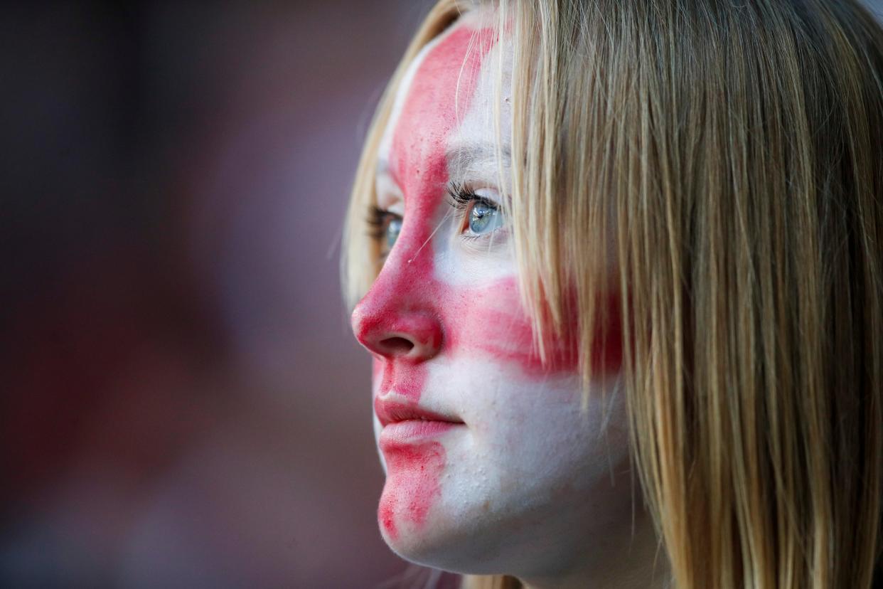 An England fan looks on before kick-off (AP)