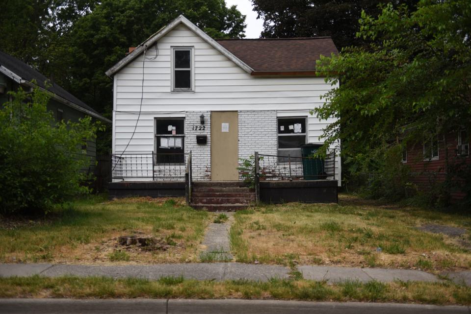 A home located at 1722 Donora St. in Lansing is seen on Monday, June 12, 2023, with a boarded-up front door. It has been red-tagged since Sept. 22, 2006, and is one of the oldest tags in the city.