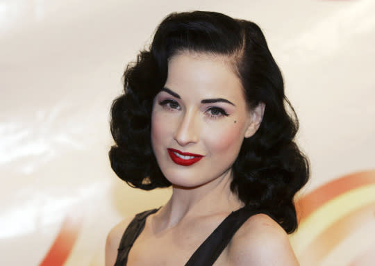 <p>The burlesque artist is known for her red lipstick and retro glamour. As a collector of vintage lipstick tubes, she’s said she transfers her favorite formulas into more attractive old cases. </p>