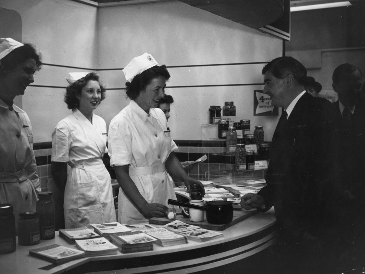 Minister of Health Aneurin Bevan jokes with nurses in 1947: Getty