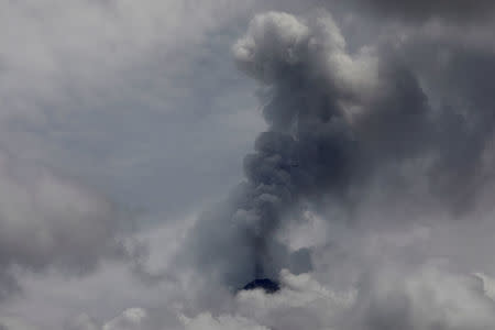 FILE PHOTO: Smoke spews from the Fuego volcano, seen from San Miguel Los Lotes in Escuintla, Guatemala June 13, 2018. REUTERS/Carlos Jasso/File Photo