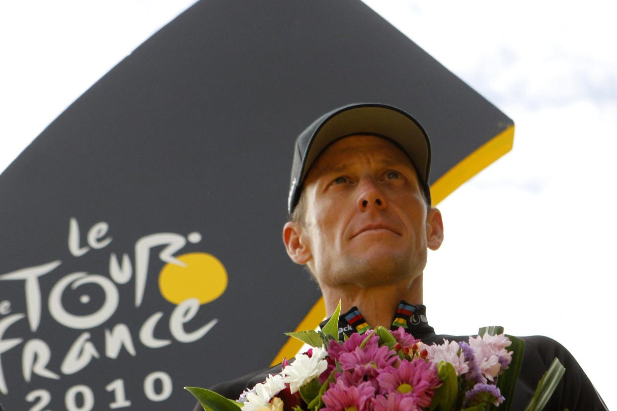 US Lance Armstrong, leader of US Radioshack cycling team, best one in the Tour de France 2010, poses on the podium as part of his last participation in the race after winning it sevent times, at the end of the 102,5 km and last stage of the 2010 Tour de France cycling race run between Longjumeau and Paris Champs-Elysees avenue.     AFP PHOTO / JOEL SAGET (Photo credit should read JOEL SAGET/AFP via Getty Images)