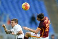 Roma's midfielder from Italy Alessandro Florenzi (R) and Atalanta's midfielder from Argentina Alejandro Gomez jump for the ball during the Italian Serie A football match AS Roma vs Atalanta on November 29, 2015 at Rome's Olympic stadium