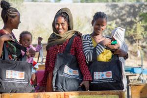 Conflict-affected women with their UNFPA Dignity Kits at Meserete IDP camp in Mekelle, Tigray. Photo by © UNFPA Ethiopia - Paula Seijo.