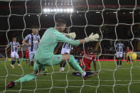 Liverpool's Sadio Mane scores the opening goal past West Bromwich Albion's goalkeeper Sam Johnstone during an English Premier League soccer match between Liverpool and West Bromwich Albion at the Anfield stadium in Liverpool, England, Sunday Dec. 27, 2020. (Nick Potts/Pool via AP)