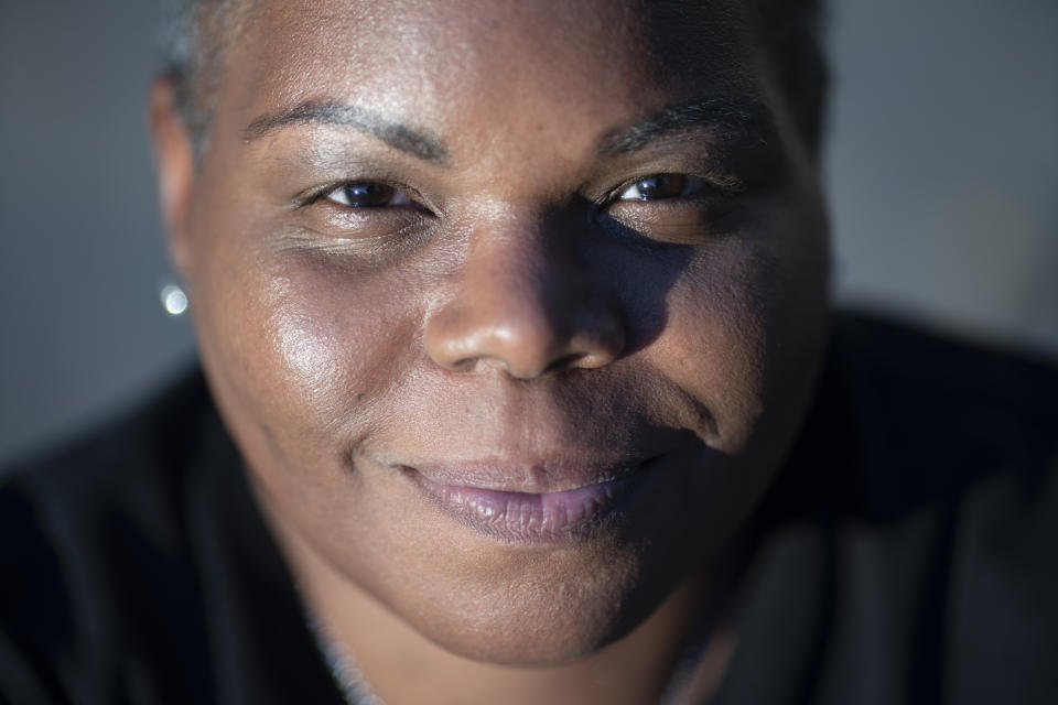 Melanese Marr-Thomas poses for a portrait outside her home in District Heights, Md., on Wednesday, Sept. 21, 2022. (AP Photo/Wong Maye-E)