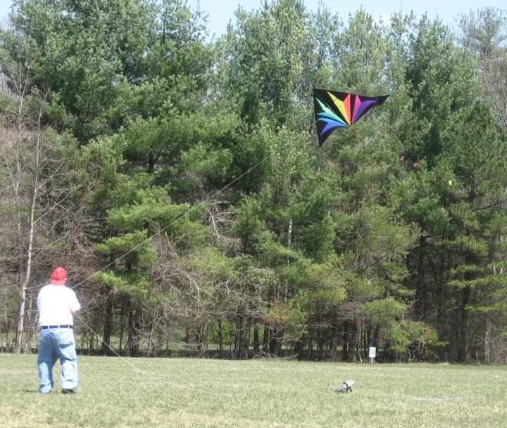 A participant in a past kite festival in Hendersonville flies a kite.