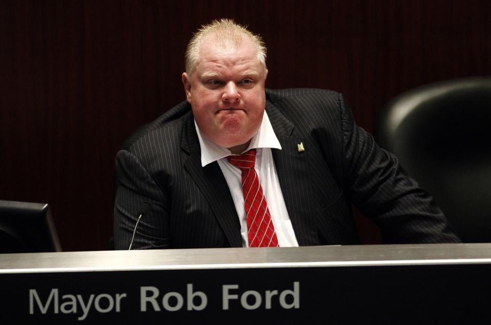 Toronto Mayor Rob Ford shown during a special council meeting at City Hall in Toronto in this November 18, 2013, file photo. Ford, who won global ridicule last year after admitting to having used crack cocaine, registered on January 2, 2014, for the October mayoral election, saying he was the best mayor Canada's largest city has ever had and would be re-elected. REUTERS/Aaron Harris/Files (CANADA - Tags: POLITICS)