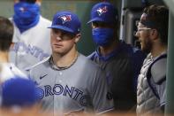 Toronto Blue Jays' Chase Anderson, left, enters the dug out after pitching during the third inning of a baseball game against the Boston Red Sox, Saturday, Aug. 8, 2020, in Boston. (AP Photo/Michael Dwyer)