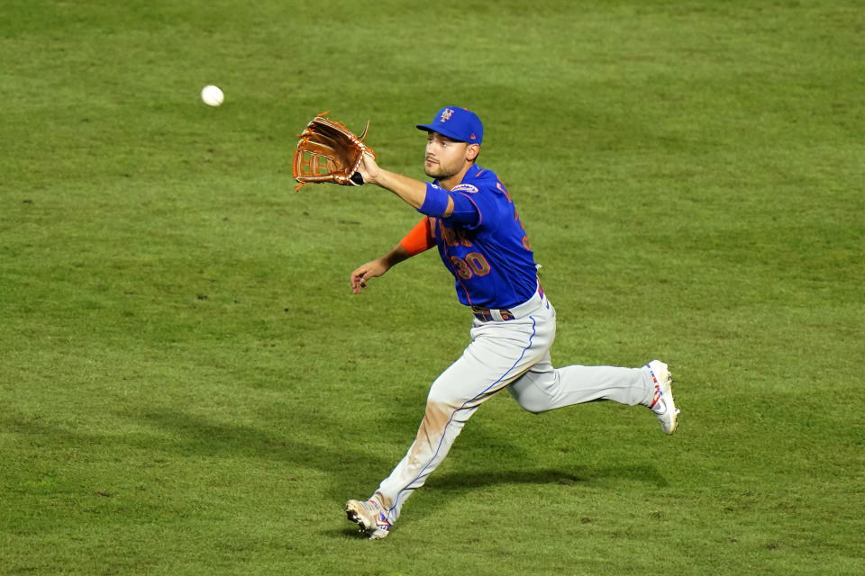 New York Mets right fielder Michael Conforto catches a line out by Philadelphia Phillies' Didi Gregorius during the third inning of a baseball game, Friday, Aug. 14, 2020, in Philadelphia. (AP Photo/Matt Slocum)