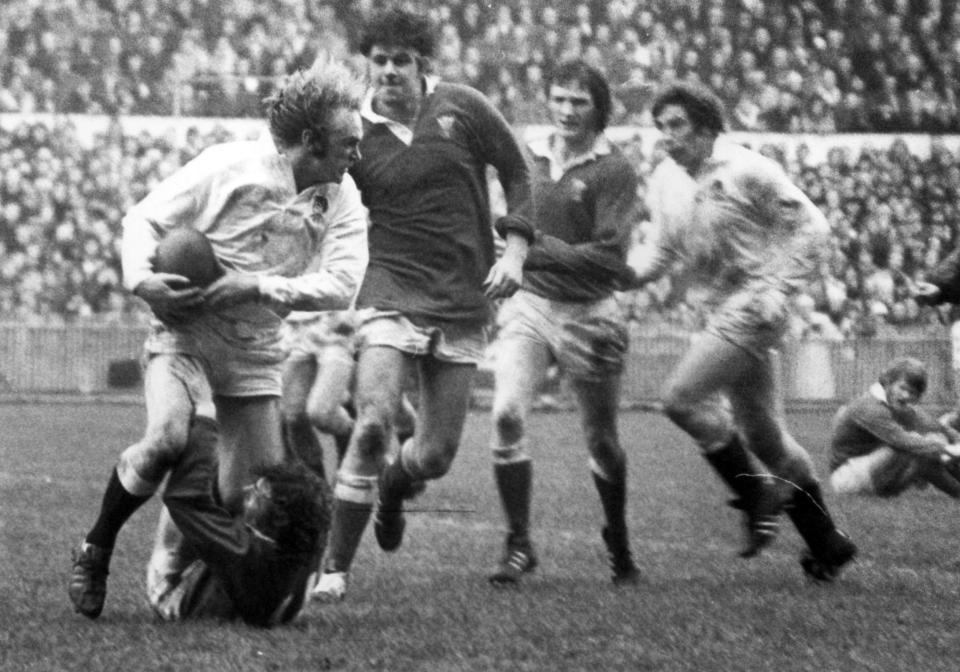 Williams tackles David Duckham during Wales's FIve Nations match against England in Cardiff in 1975: Williams scored a try in a 20-4 victory - Huw Evans Agency