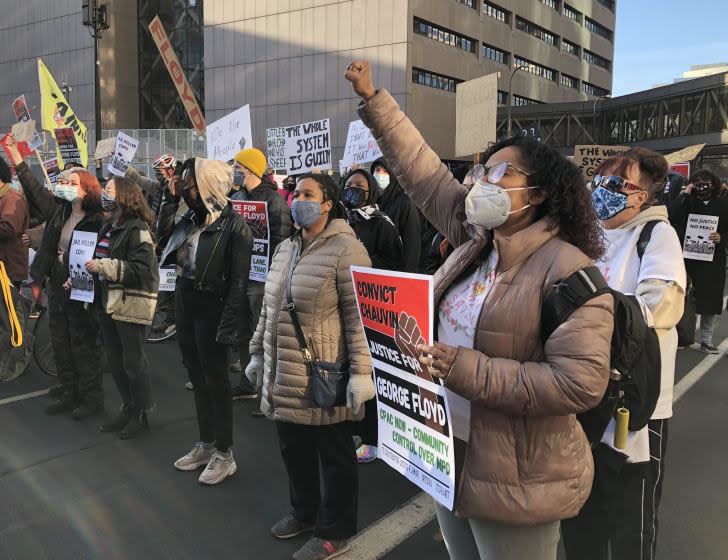 Samantha Pree-Gonzalez, (right) protests outside the courthouse in downtown Minneapolis where former police officer Derek Chauvin is standing trial for the murder of George Floyd.